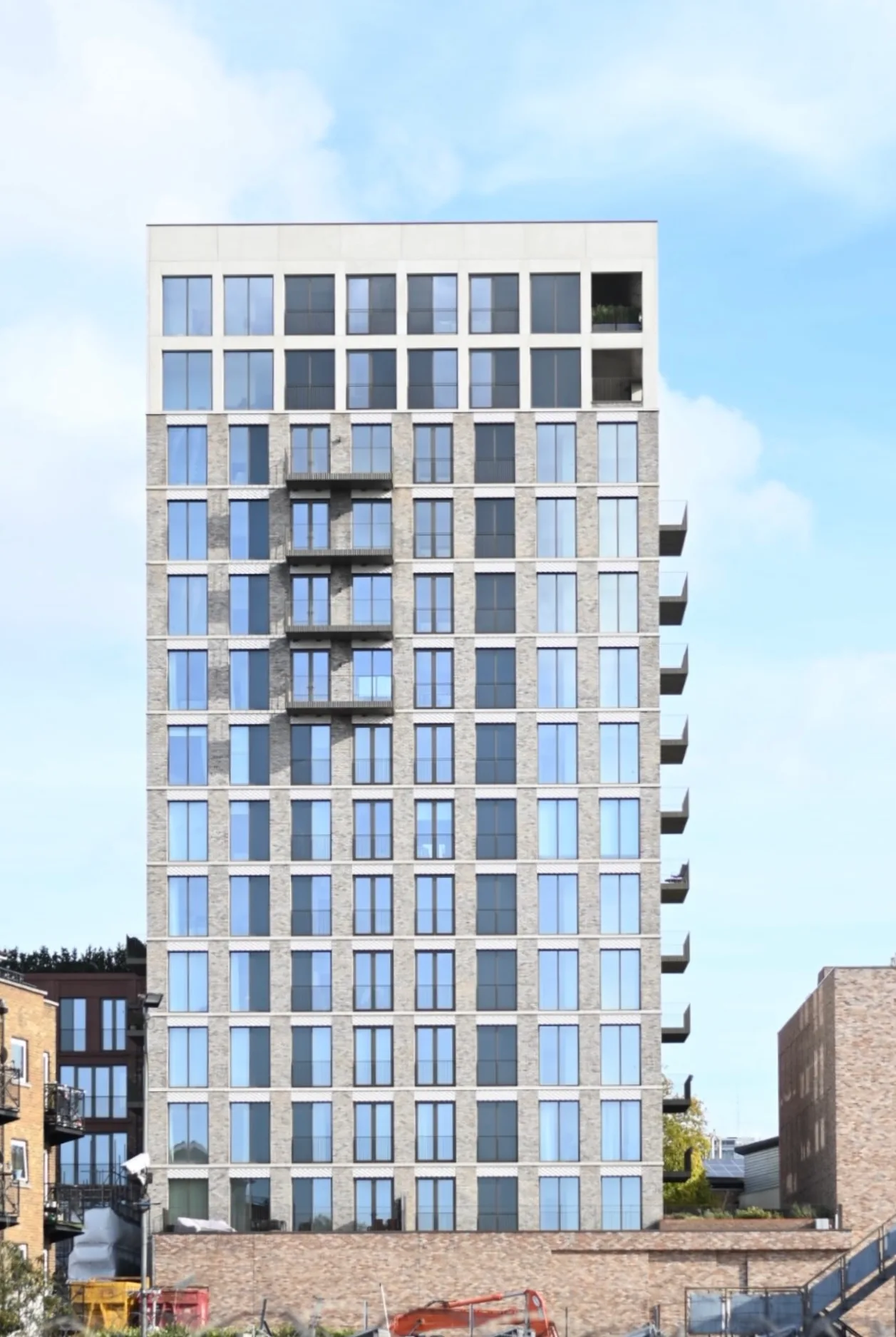 Architectural photography, tall building against blue sky by OhBe London