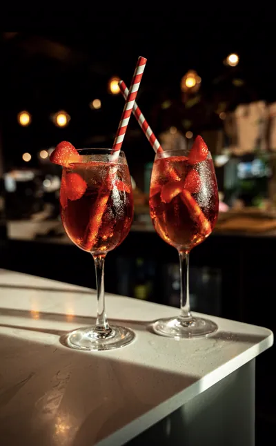 Two strawberry spritzes on the Apex Lounge bar